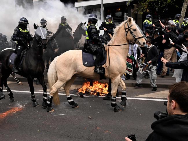 Protesters confront police outside the Land Forces 2024 arms fair in Melbourne on September 11, 2024. (Photo by William WEST / AFP)