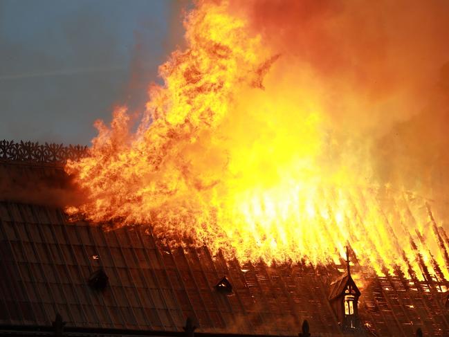 Flames and smoke are seen billowing from the roof at Notre-Dame Cathedral April 15, 2019 in Paris, France. (Photo by Pierre Suu/Getty Images)