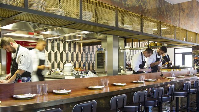 Chefs in the open kitchen at L'Hotel Gitan. Picture: Sarah Matray