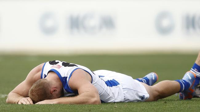 Ben McKay lays prone after being collected by Aaron Naughton.