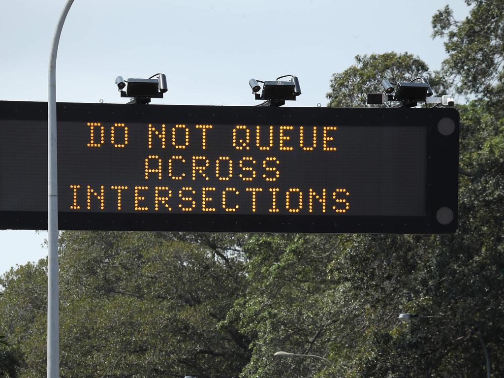 Three of the cameras are pictured fixed to a traffic sign on Anzac Parade at Moore Park near Alison Rd. Picture: David Swift