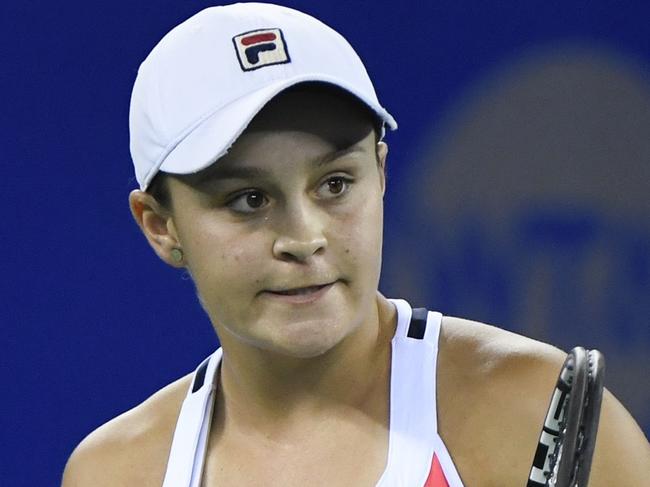 Ashleigh Barty of Australia reacts after winning a point against Jelena Ostapenko of Latvia during their women's singles semifinals match at the WTA Wuhan Open tennis tournament in Wuhan, in China's central Hubei province on September 29, 2017. / AFP PHOTO / WANG ZHAO