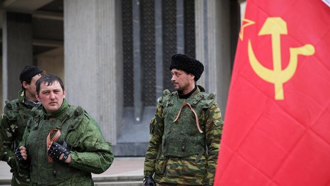 Alleged Russian troops guard the Perevalnoye Ukrainian Army Base. Picture: Ella Pellegrini