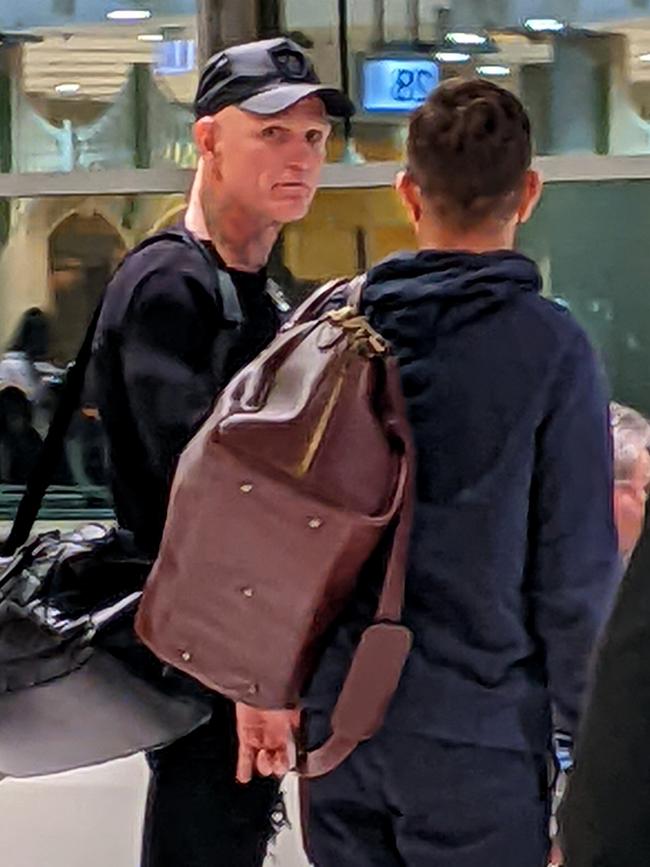 Nick “The Knife” Forbes at the Brisbane Domestic airport before boarding a flight to Darwin with his lawyer Michael Gatenby on Monday. Picture David Clark