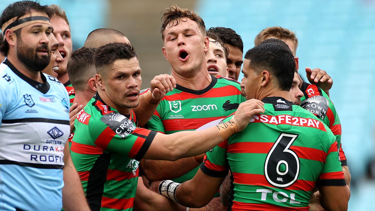 The Rabbitohs celebrate an Adam Reynolds try against the Sharks. Picture. Phil Hillyard