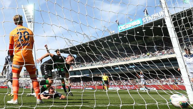 Besart Berisha of Western United gets the ball past Victory goalkeeper Lawrence Thomas earlier this month in Geelong, Australia. Picture: Getty Images