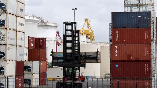 A worker moves containers at the compound of ports operator DP World at Port Botany in Sydney on November 13, 2023. Picture: David Gray / AFP