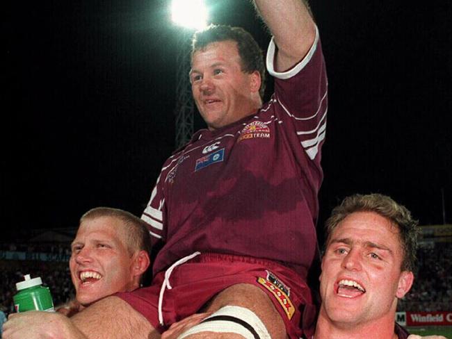 Gary Larson (L) & Billy Moore lift captain Trevor Gillmeister on their shoulders after victory in third 1995 State of Origin match, New South Wales (NSW) v Queensland, at Suncorp Stadium. Sport / Rugby League / With Others