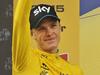 Britain's Chris Froome, wearing the overall leader's yellow jersey, celebrates on the podium of the nineteenth stage of the Tour de France cycling race over 138 kilometers (85.7 miles) with start in Saint-Jean-de-Maurienne and finish in La Toussuire, France, Friday, July 24, 2015. (AP Photo/Laurent Cipriani)