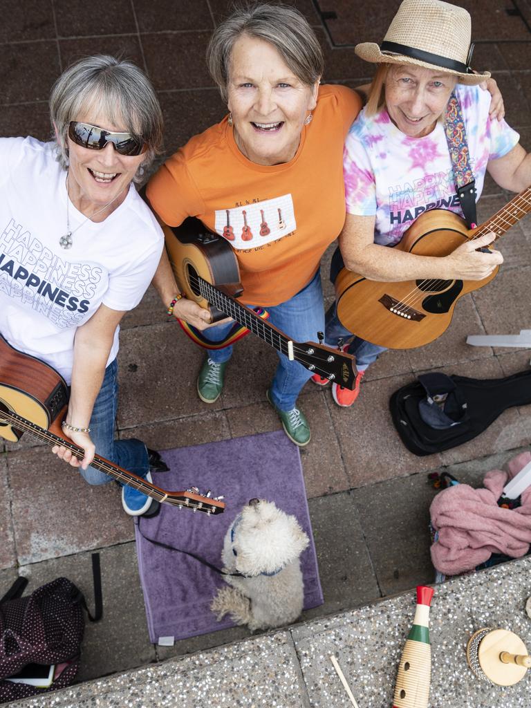 Lil Darlins members (from left) Steph Gaunt, Karen James and Cath McCourt with their dog Freddie travelled from Cleveland to perform at the Toowoomba Busking Festival, Saturday, April 29, 2023. Picture: Kevin Farmer