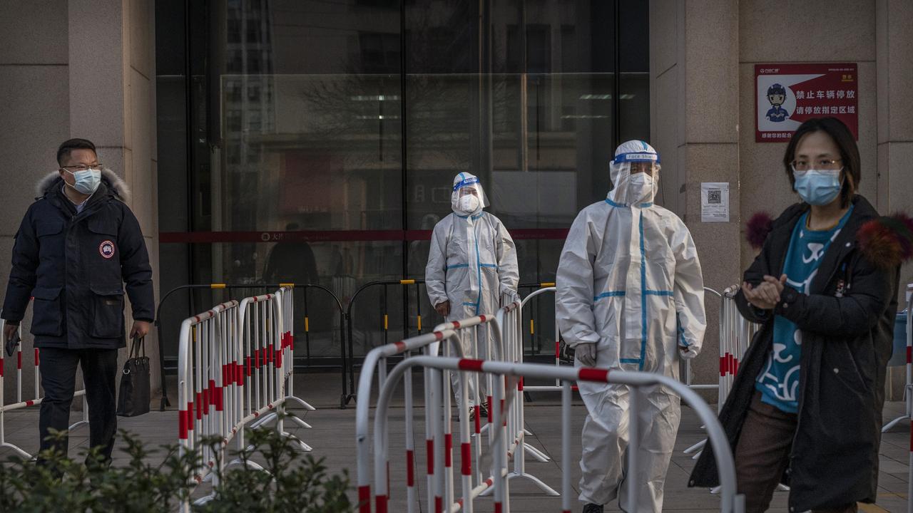 Health care workers in Beijing. Picture: Getty Images.