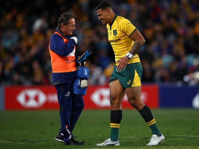 Israel Folau leaves the field injured during the loss to the All Blacks. Picture: Getty Images