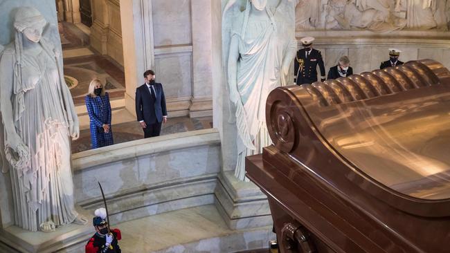 French president Emmanuel Macron and his wife Brigitte Macron stand in front of the tomb of French Emperor Napoleon during a ceremony in Paris marking the 200th anniversary of his death. Picture: AFP