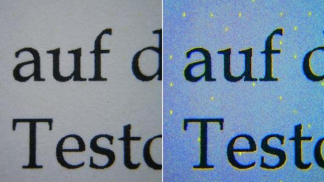 Microdots from a laser printer shown illuminated with blue light. Picture: Florian Heise/Wikipedia