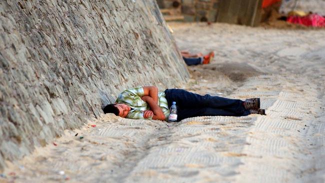 New Year’s Day Sleeping of New Year’s Eve celebrations on Mooloolaba Beach in 2004.