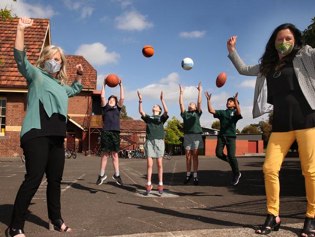 South Geelong Primary School Principal Leanne Dowling with students from left Hamish Frake, Augie Messer, Evie Villarosa and Aarav Doosa celebrate a funding announcement from MP Christine Couzens. Picture: Alison Wynd