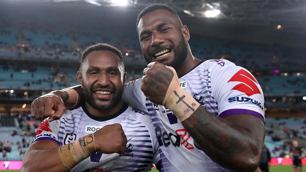 SYDNEY, AUSTRALIA - OCTOBER 25:  Justin Olam of the Storm and Suliasi Vunivalu of the Storm celebrate following the 2020 NRL Grand Final match between the Penrith Panthers and the Melbourne Storm at ANZ Stadium on October 25, 2020 in Sydney, Australia. (Photo by Cameron Spencer/Getty Images)