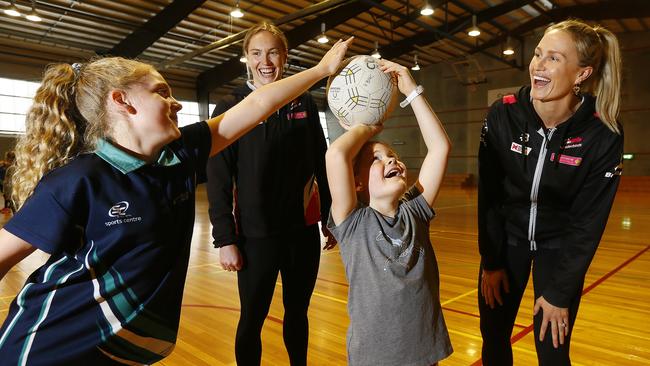 Adelaide Thunderbirds players Chelsea Pitman, right, and Hannah Petty watch as Kingborough Blues player Addison Bolwell lines up a shot under pressure from clubmate Bridey McLean. Picture: MATT THOMPSON