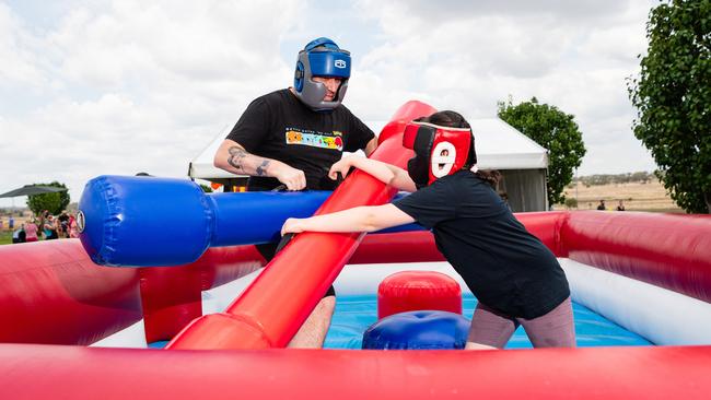 Luke Croxon and daughter Elise Croxon battle on the gladiator at Wellcamp Airport 10th anniversary community day, Sunday, November 10, 2024. Picture: Kevin Farmer