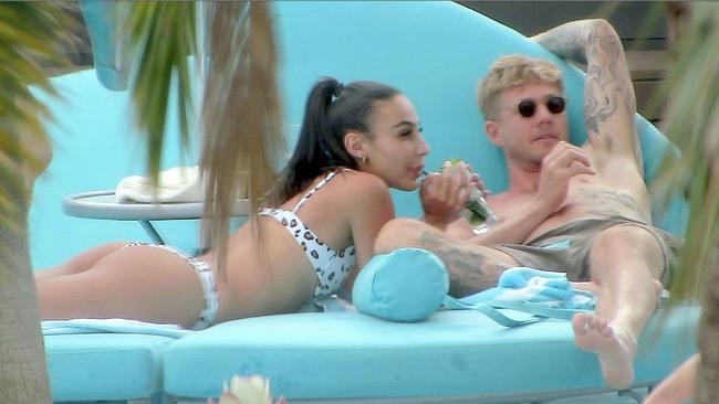 Tayla Damir and AFL player, Nathan Broad, looked cosy as they relaxed by the pool at Crown Towers in Perth. Picture: The Mega Agency