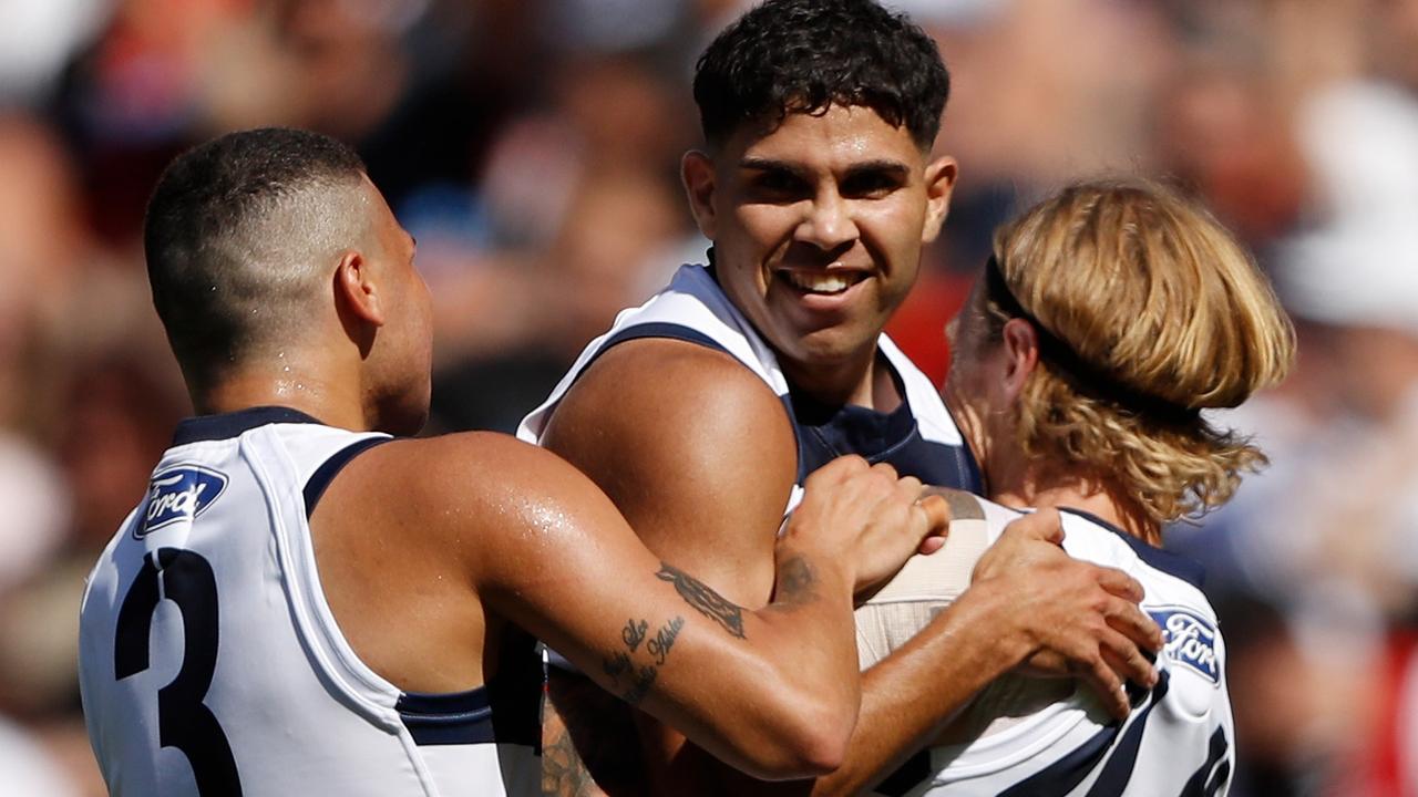 Tyson Stengle is congratulated by Tom Stewart and Brandan Parfitt after kicking one of four goals on debut for the Cats. Picture: AFL Photos via Getty Images