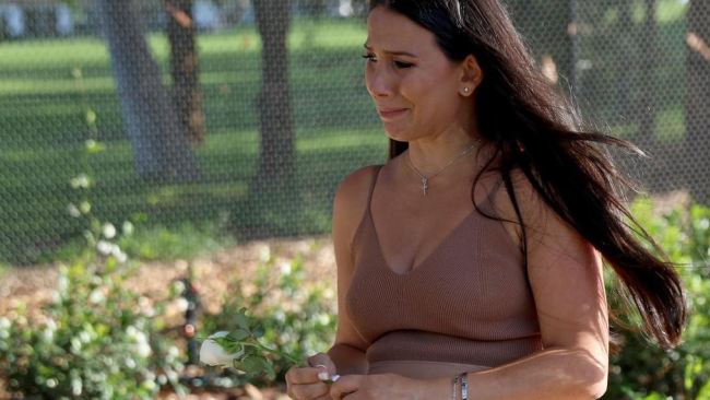 Leila Abdallah pictured laying a flower at the unveiling event of the memorial. Picture: Damian Shaw