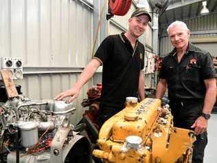 ON THE JOB: First year apprentice Callum McIntosh and Tafe automotive trainer Ian Walsh. Picture: Mike Knott BUN140819TAFE4