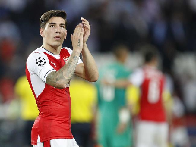 FILE - In this Tuesday, Sept. 13, 2016 file photo, Arsenal's Hector Bellerin applauds the crowd after the Champions League group A soccer match group between Paris Saint Germain and Arsenal at the Parc des Princes stadium in Paris. Spain right back Hector Bellerin has signed a new long-term deal with Arsenal as the Premier League club looks to secure the services of its leading players, it was reported on Monday, Nov. 21, 2016. Arsenal manager Arsene Wenger is also keen to tie up new deals for star forwards Alexis Sanchez and Mesut Ozil, whose contracts expire in June 2018. (AP Photo/Christophe Ena, File)