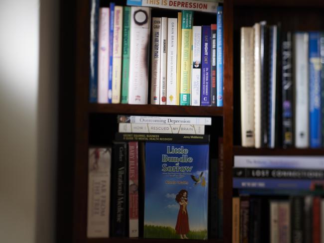 Nicole’s bookshelf within her Perth home. Photo: Frances Andrijich / TWAM
