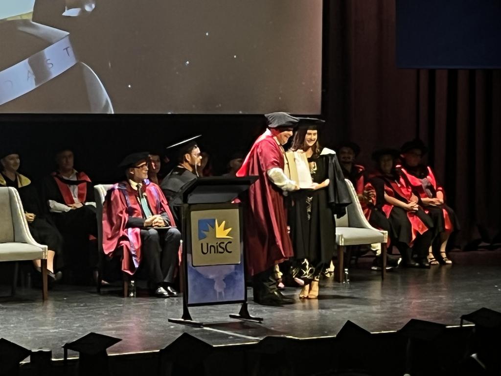 Graduates from the University of the Sunshine Coast's Fraser Coast campus celebrating at the Brolga Theatre.