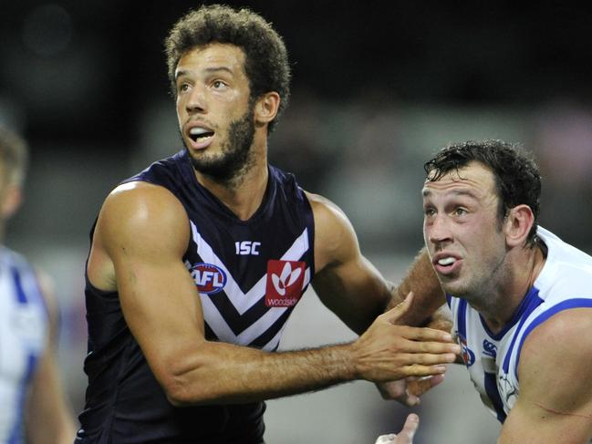 Fremantle Dockers v North Melbourne at Subiaco Oval in Perth. pictured - Docker Zac Clarke takes on North Melbournes Todd Goldstein