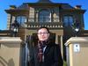 Li Ming is the director of Aussiehome Real Estate, outside of one of the 'French Provincial' style houses he sold recently in Balwyn that is extremely popular with Chinese investors.