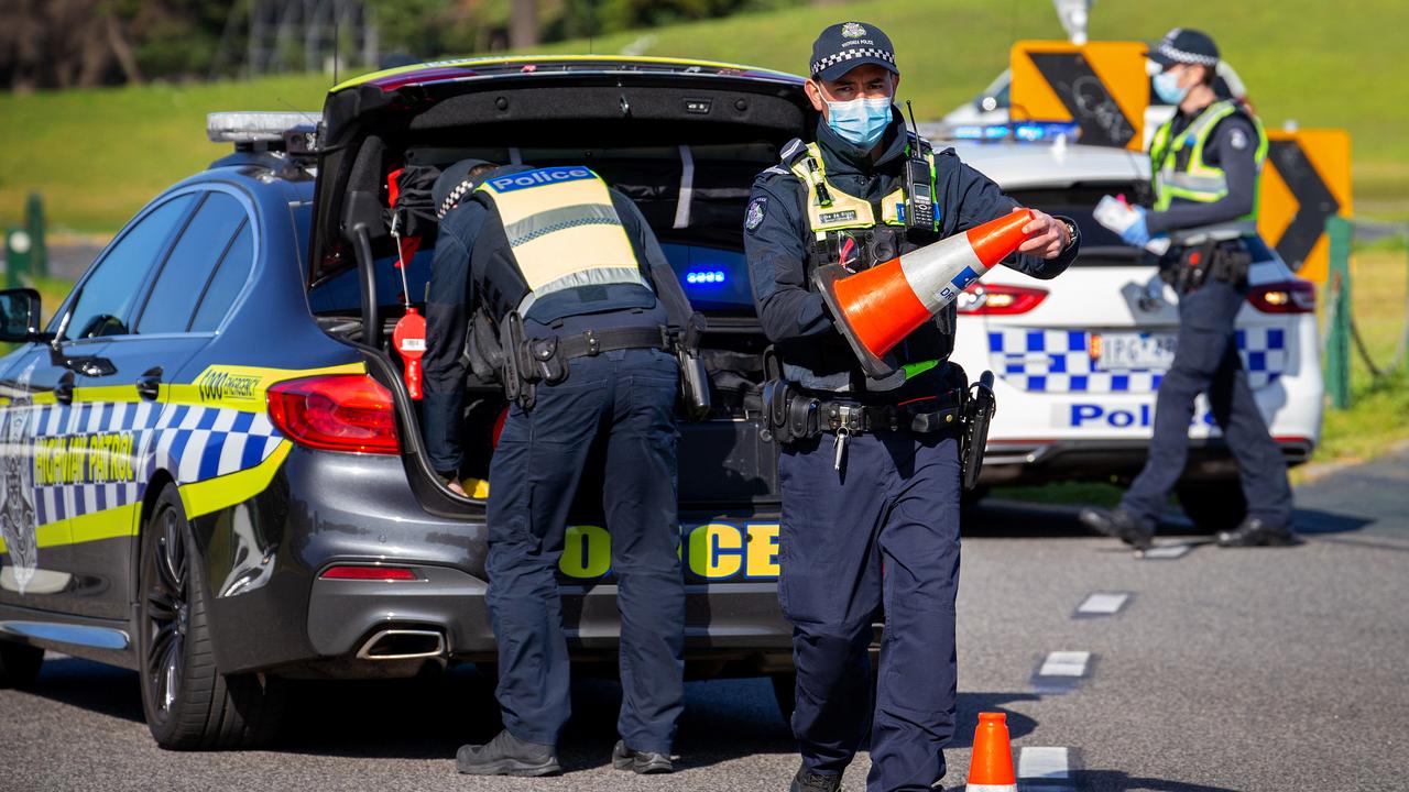 Police officers conducting checks at Albert Park. Picture: Mark Stewart