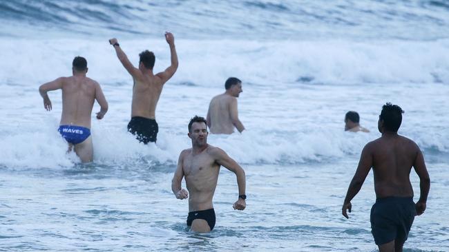 Crowds flock to Bondi Beach and brave the cold as lockdown restrictions ease. Picture: Matrix