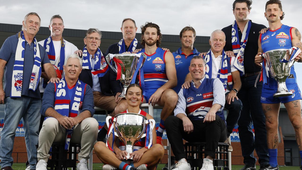 Western Bulldogs mark the club’s 100th year celebration: (l-r) Terry Wheeler, Rohan Smith, Paul Hudson, Kelvin Templeton, AFLW captain Ellie Blackburn (front), Rick Kennedy, Marcus Bontempelli, Luke Beveridge, Paul Dimmatina, Brian Royal, Tom Boyd and Tom Liberatore. Picture: Michael Klein