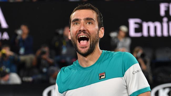 Croatia's Marin Cilic celebrates beating Britain's Kyle Edmund in their men's singles semi-final. Picture: AFP.