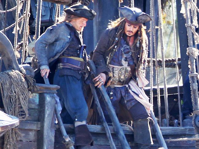 Johnny Depp and a castmate shoot scenes on board The Dying Gull on the set of Pirates of the Caribbean: Dead Men Tell No Tales at The Spit. Picture: Tim Marsden