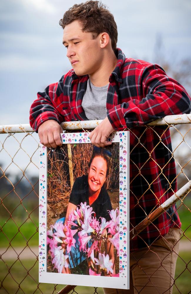 Alicia's eldest child, Ariki Little, with a photo of his late mother. Picture: Mark Stewart