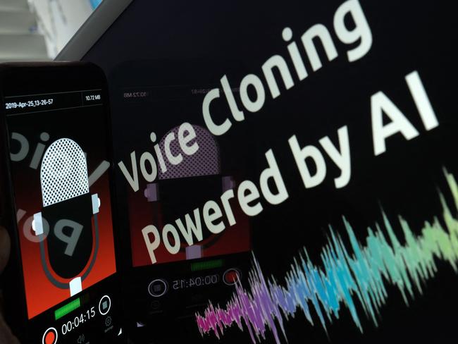 This illustration image created on June 9, 2023, shows a smartphone recording in front of a voice cloning screen in Los Angeles. The biggest peril of Artificial Intelligence, experts say, is its ability to blur the boundaries between reality and fiction, handing cybercriminals a cheap and effective technology to exploit. In a new breed of scams that has rattled US authorities, fraudsters are using strikingly convincing AI voice cloning tools -- widely and cheaply available online -- to steal from people by impersonating family members. (Photo by Chris Delmas / AFP)