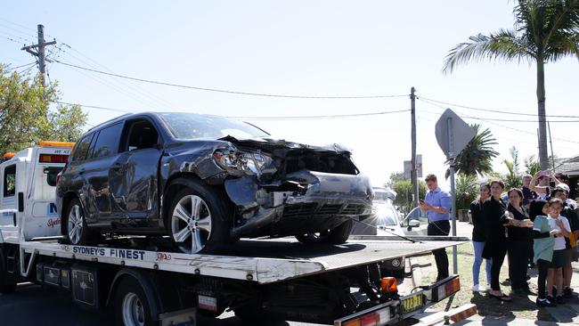 A father has told of his efforts to pull the 4WD (pictured) off several badly injured students after it crashed into a classroom. Picture: Jonathan Ng