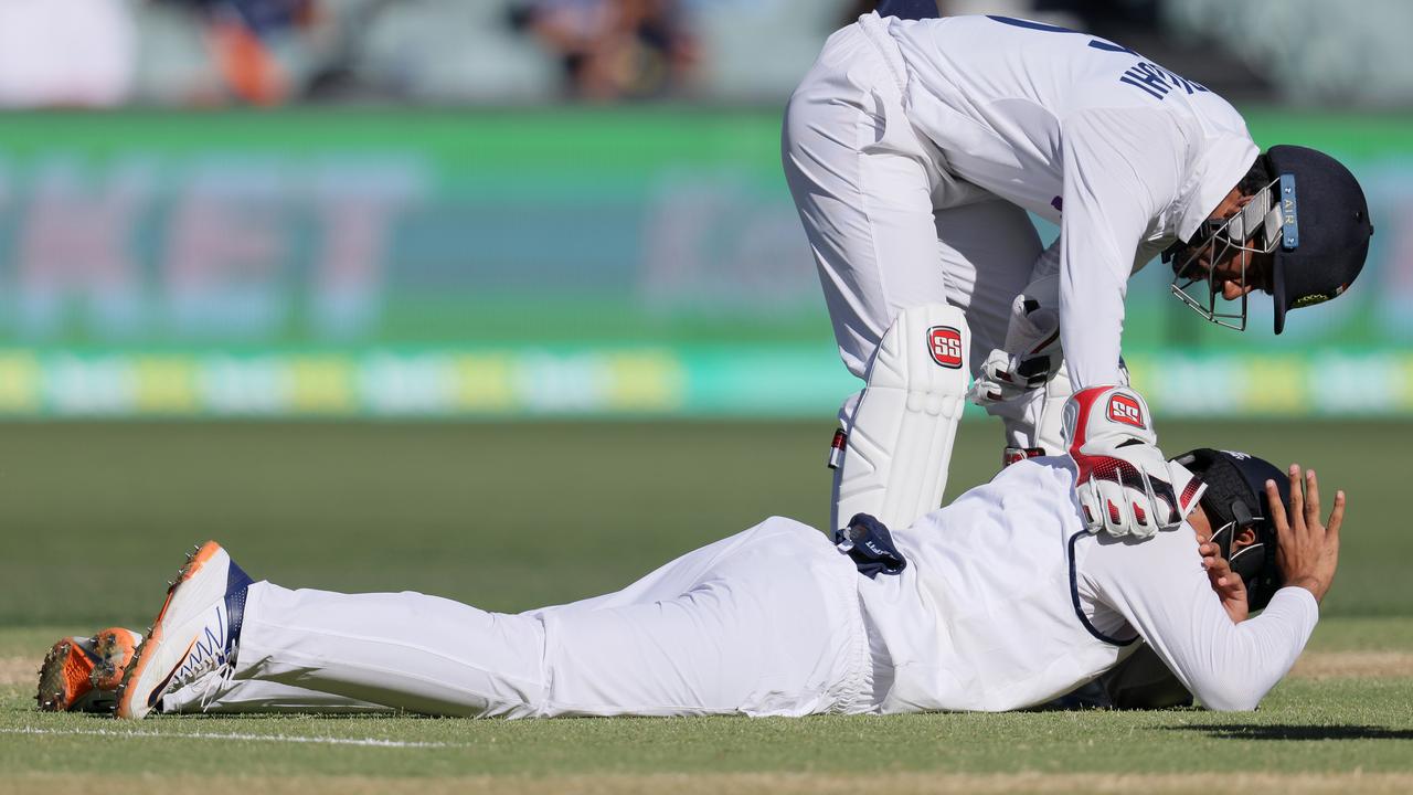 Hanuma Vihari lays on the ground after being struck on the shoulder by a ball during day three. (Photo by Daniel Kalisz/Getty Images)