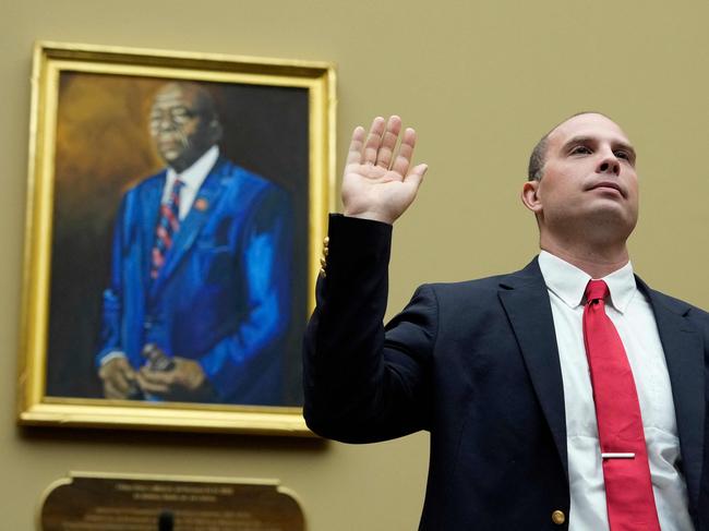 David Grusch, ex-intel officer at the Department of Defence’s UAP Task Force, is sworn-in before testifying on a Pentagon cover-up of alien contact. Picture: AFP