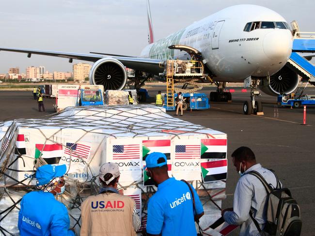 Aid workers check a shipment of Covid vaccines sent to Sudan by the Covax vaccine-sharing initiative. Picture: AFP