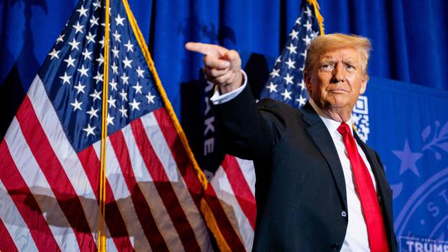 Donald Trump points to supporters at the conclusion of a campaign rally in New Hampshire. Picture: Brandon Bell/Getty Images/AFP