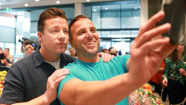 Jamie Oliver poses for a selfie with Kellyville shopper Joey.