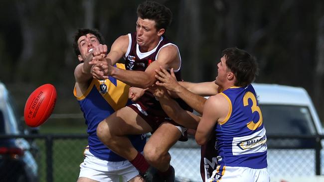 Harrison Hanley battles two Sebastopol defenders. Picture: Hamish Blair