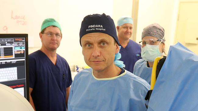 Dr Charles Chabert WITH nurse Ken Lloyd, theatre technician Rob Davidson and nurse Sam Kurtz. Photo by Richard Gosling