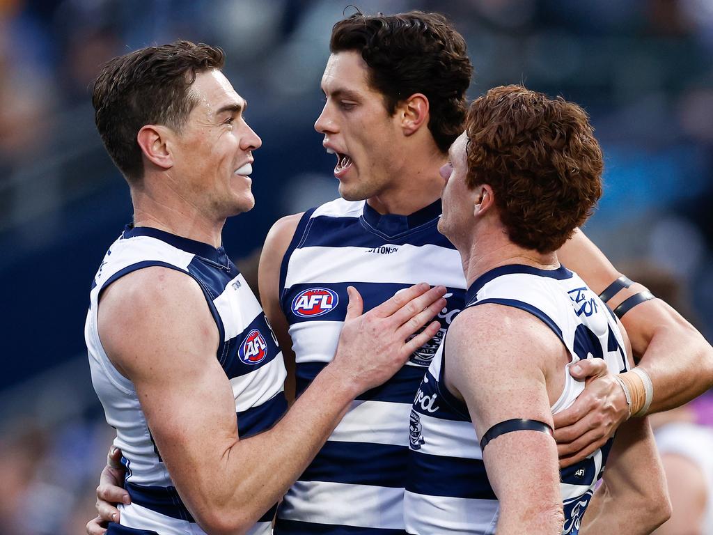 GEELONG, AUSTRALIA - JULY 06: (L-R) Jeremy Cameron, Shannon Neale and Gary Rohan of the Cats celebrate during the 2024 AFL Round 17 match between the Geelong Cats and the Hawthorn Hawks at GMHBA Stadium on July 06, 2024 in Geelong, Australia. (Photo by Michael Willson/AFL Photos via Getty Images)