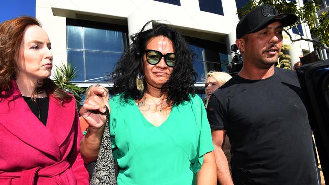 Uiatu "Joan" Taufua (centre) at a court appearance