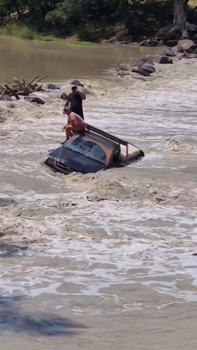 Two rescued from ute in croc-infested Cahills Crossing | The Courier Mail